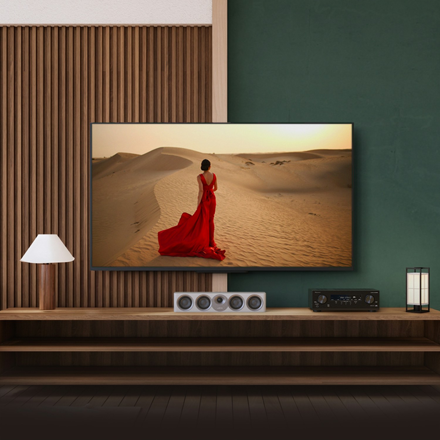 Pioneer VSX 835 powering home Jamo system with red dress woman on tv 2000x2000